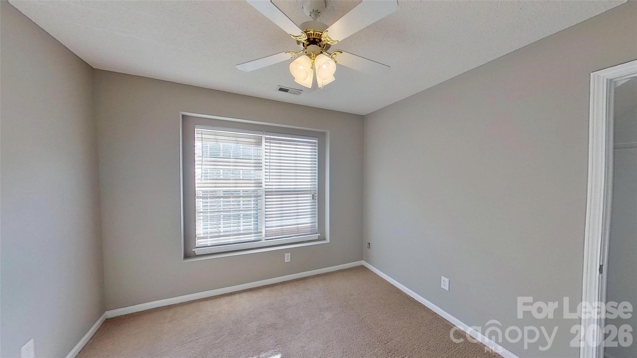 7236 Rock Island Road Charlotte, NC 28278 - Photo 6 of 11 a view of an empty room with a window