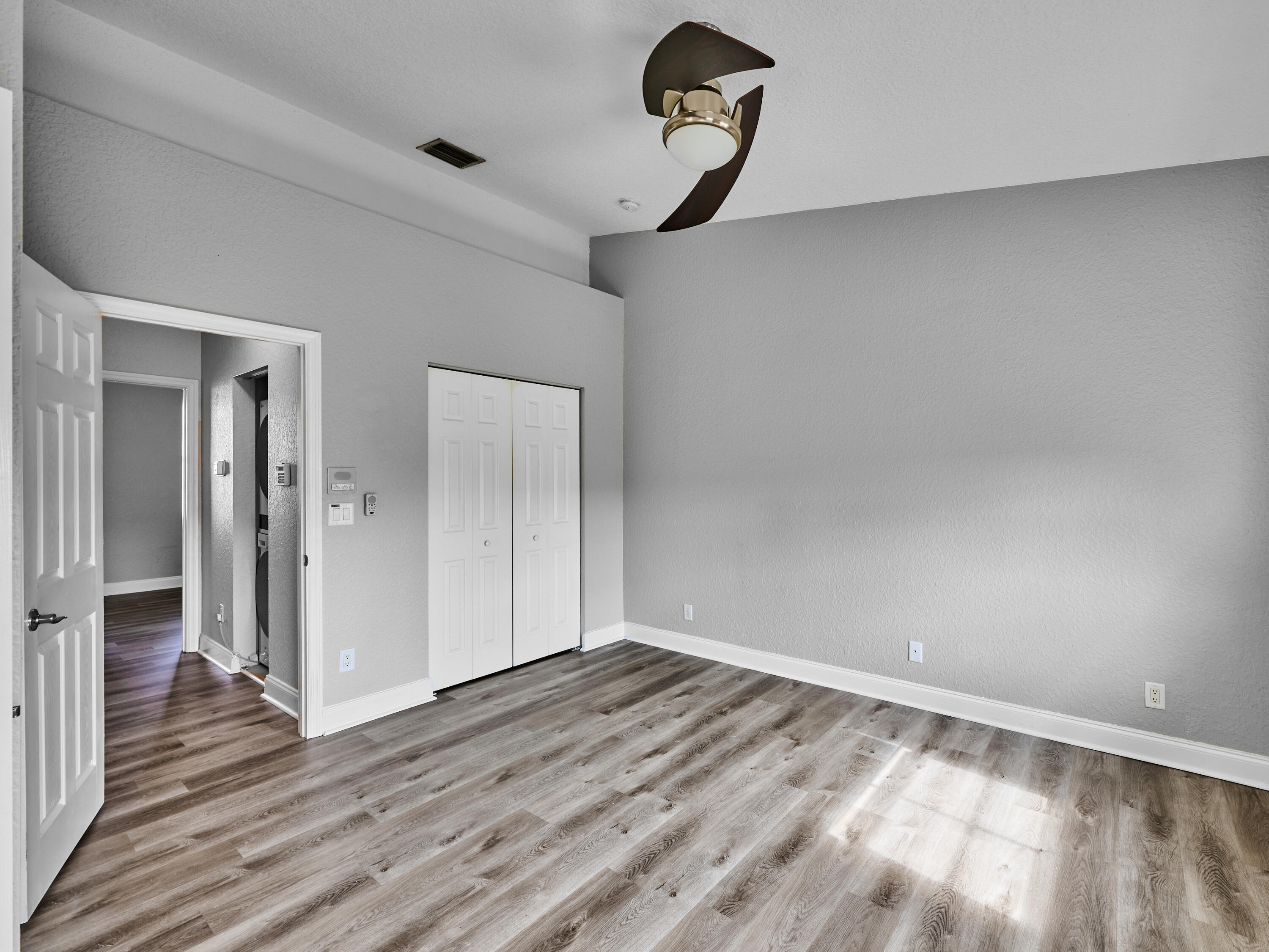 105 East Pigeon Plum Drive, Unit 103 Jupiter, FL 33458 - Photo 27 of 38 a view of a room with wooden floor