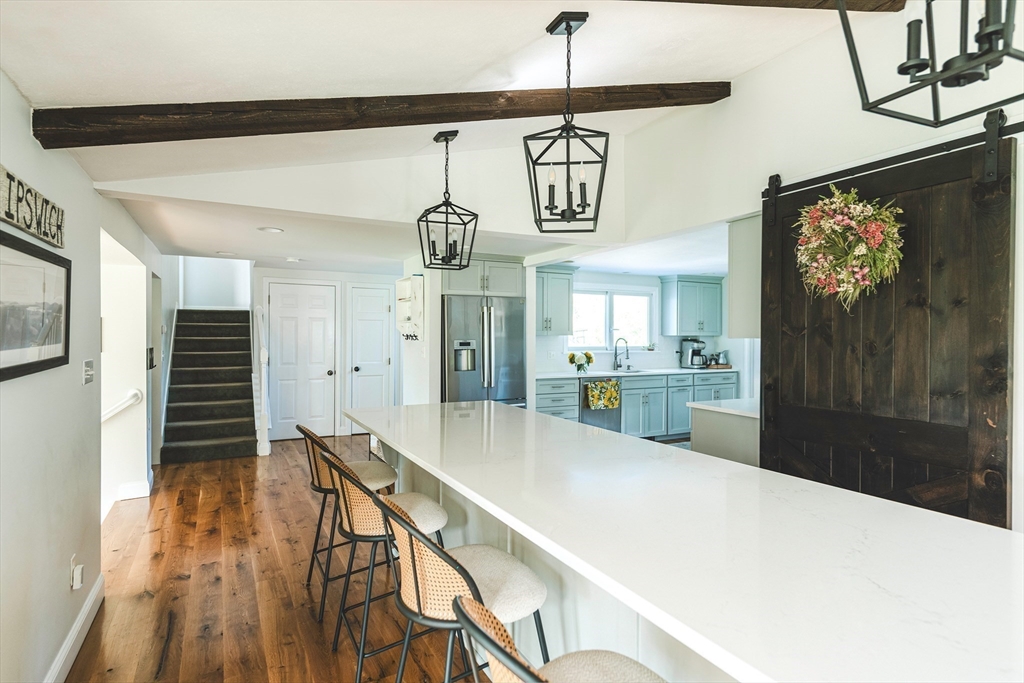 50 Jeffrey's Neck Road Ipswich, MA 01938 - Photo 14 of 41 a kitchen with kitchen island a counter top space a sink stainless steel appliances and cabinets