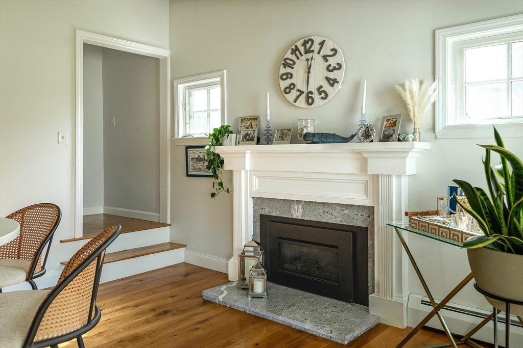 50 Jeffrey's Neck Road Ipswich, MA 01938 - Photo 18 of 41 a living room with furniture and a fireplace
