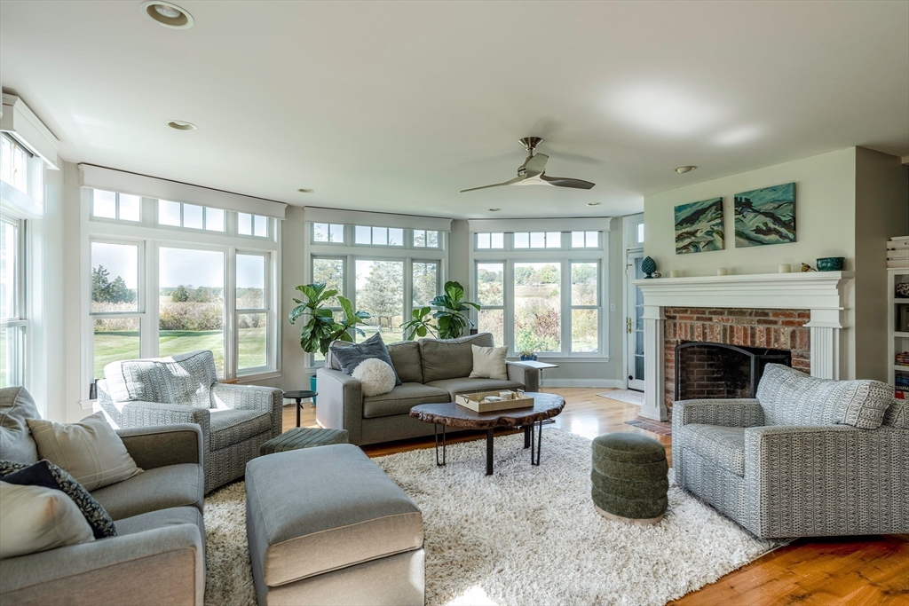 50 Jeffrey's Neck Road Ipswich, MA 01938 - Photo 22 of 41 a living room with furniture and a fireplace