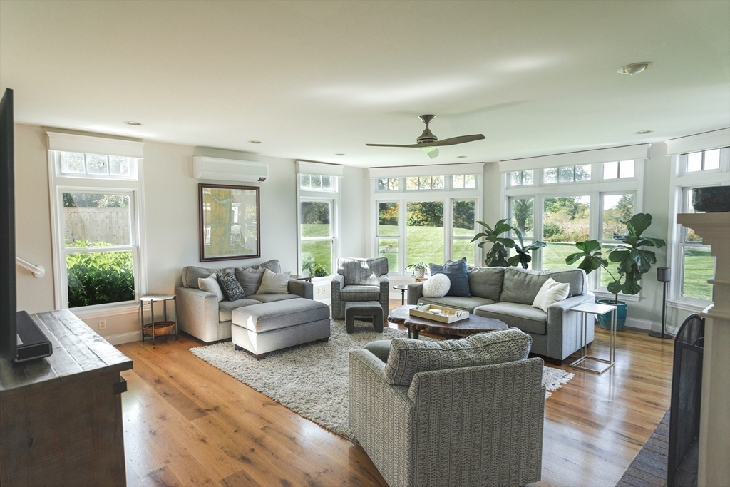 50 Jeffrey's Neck Road Ipswich, MA 01938 - Photo 23 of 41 a living room with furniture and a large window