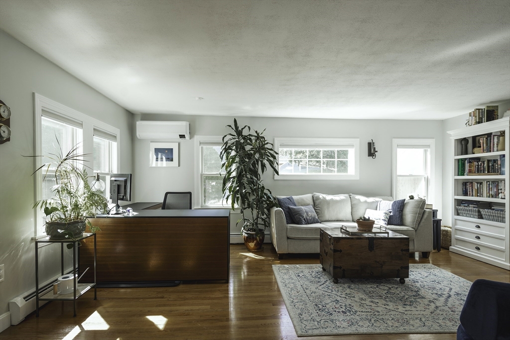 50 Jeffrey's Neck Road Ipswich, MA 01938 - Photo 25 of 41 a living room with furniture and a potted plant