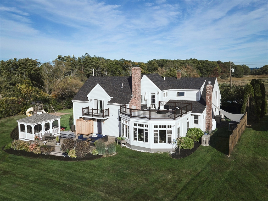 50 Jeffrey's Neck Road Ipswich, MA 01938 - Photo 3 of 41 a view of a house with a big yard and large trees