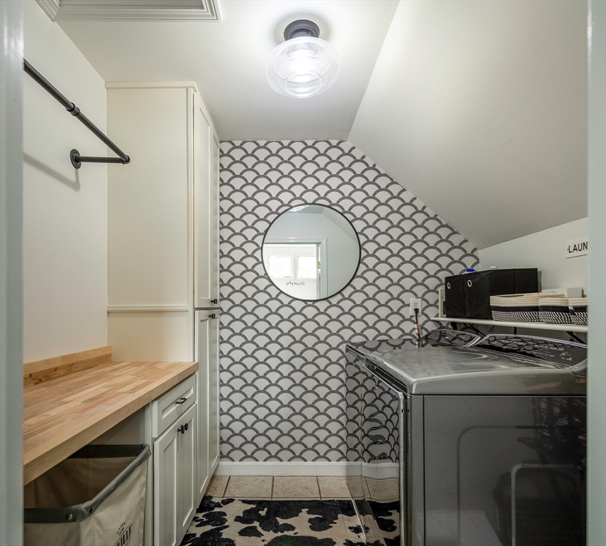 50 Jeffrey's Neck Road Ipswich, MA 01938 - Photo 32 of 41 a bathroom with a sink a toilet and a mirror