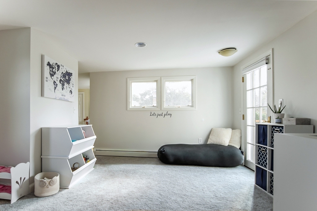 50 Jeffrey's Neck Road Ipswich, MA 01938 - Photo 36 of 41 a bedroom with a bed and a window