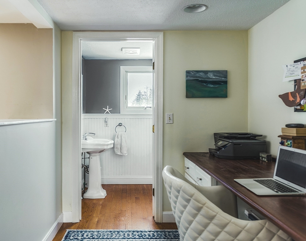 50 Jeffrey's Neck Road Ipswich, MA 01938 - Photo 37 of 41 a bathroom with a toilet a sink and mirror