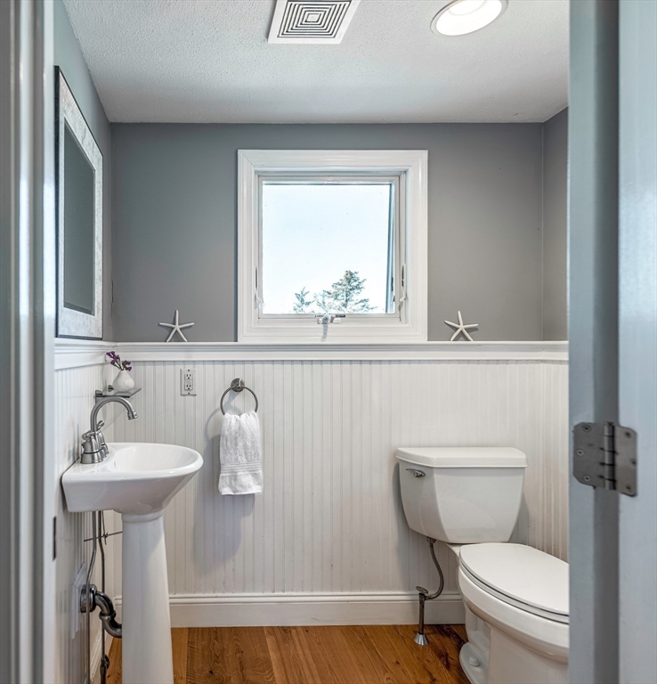 50 Jeffrey's Neck Road Ipswich, MA 01938 - Photo 38 of 41 a bathroom with a toilet sink and mirror