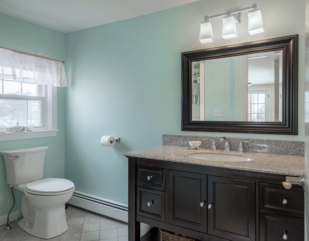 50 Jeffrey's Neck Road Ipswich, MA 01938 - Photo 39 of 41 a bathroom with a toilet sink and mirror