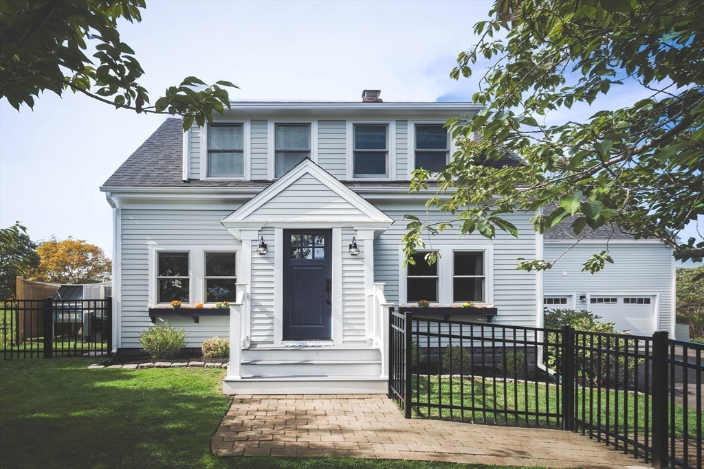 50 Jeffrey's Neck Road Ipswich, MA 01938 - Photo 5 of 41 a front view of a house with a yard