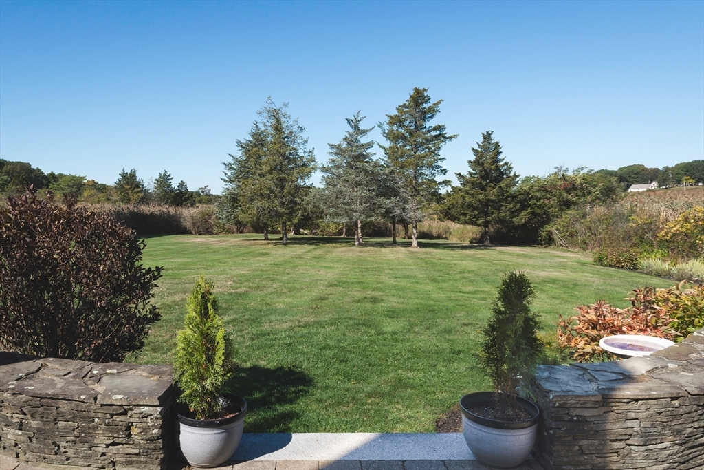50 Jeffrey's Neck Road Ipswich, MA 01938 - Photo 9 of 41 a view of a garden with lake and houses