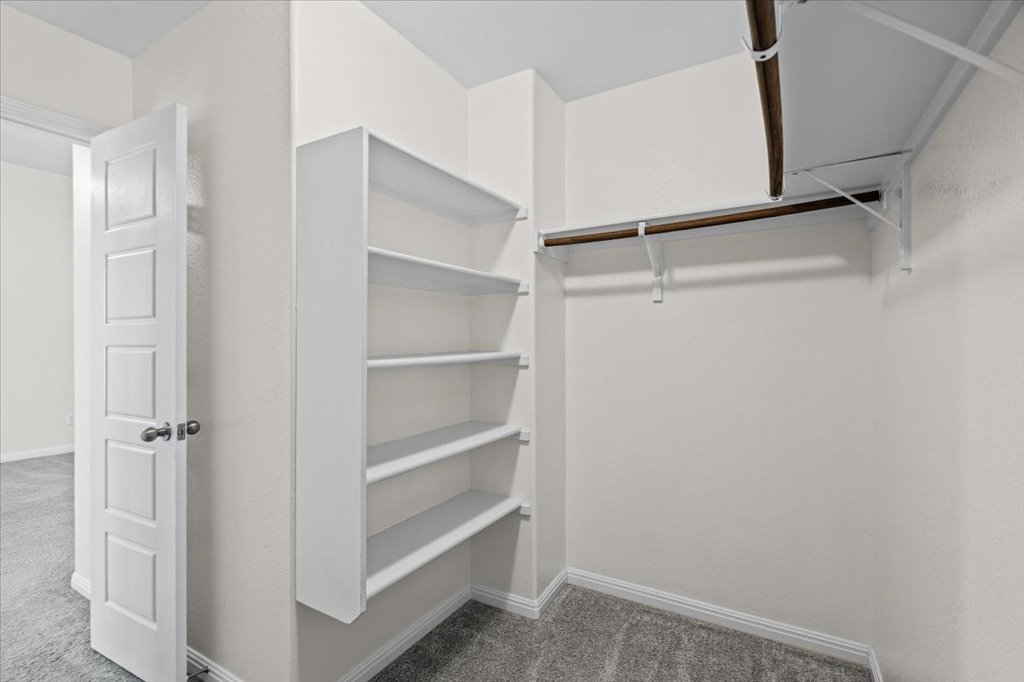 1502 Airedale Road, Unit 2502 Austin, TX 78748 - Photo 19 of 28 Functional custom built-ins and ample hanging space create an organized storage solution.