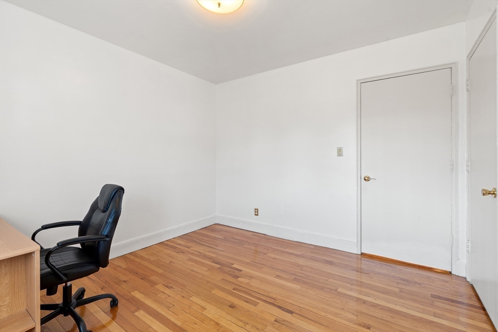 130 Boylston Street, Unit 3 Newton, MA 02467 - Photo 13 of 24 a view of a workspace with wooden floor