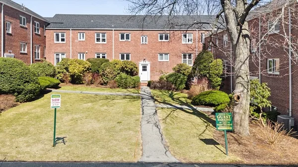 a kitchen with a sink appliances and cabinets