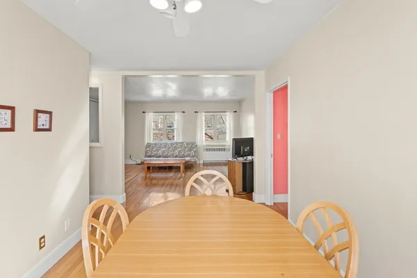 a dining room with furniture and window