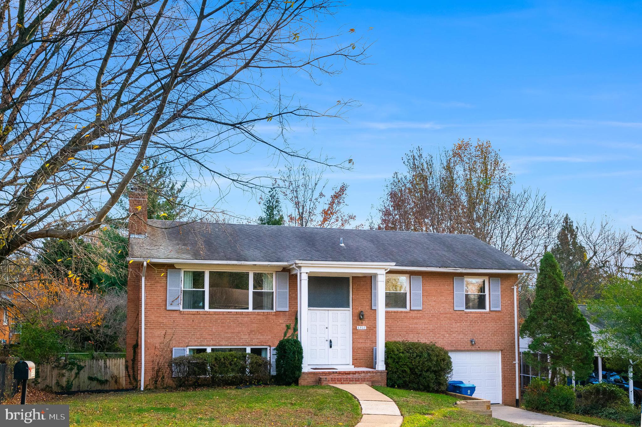 6503 Machodoc Court Falls Church, VA 22043 - Photo 2 of 34 front view of house with a yard