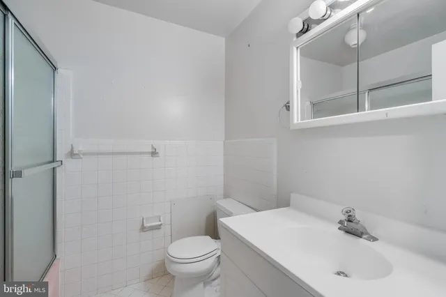 a bathroom with a sink toilet and vanity