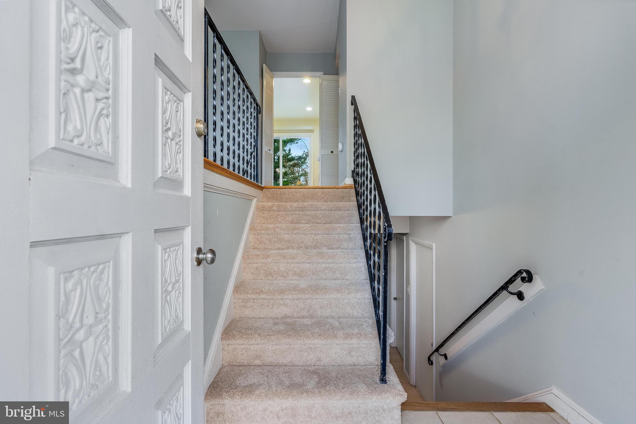 6503 Machodoc Court Falls Church, VA 22043 - Photo 3 of 34 a view of staircase with lots of frames on wall and paintings on the wall