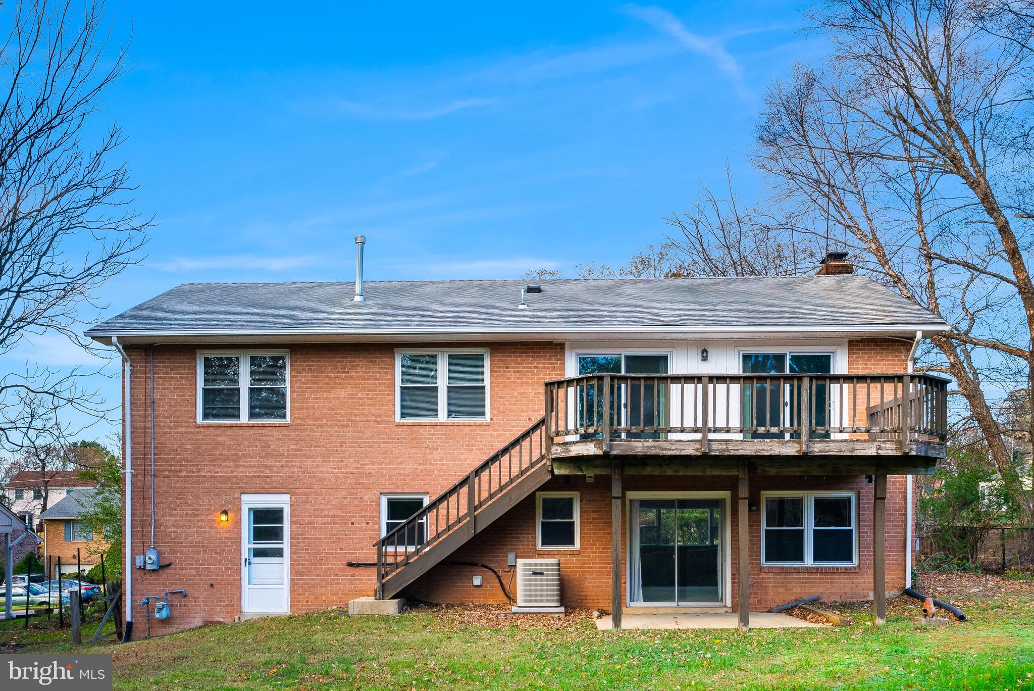 6503 Machodoc Court Falls Church, VA 22043 - Photo 32 of 34 a front view of a house with garden