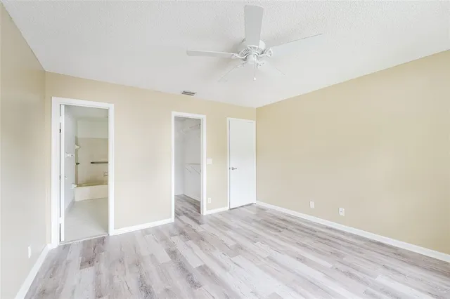 a view of an empty room and wooden floor