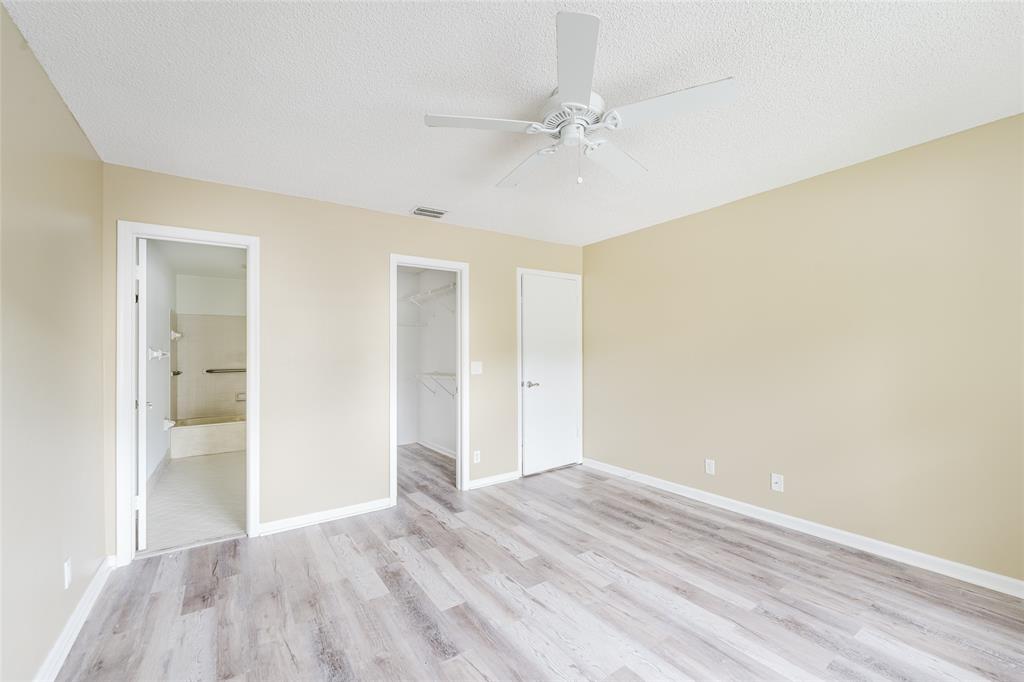 Undisclosed Address Boca Raton, FL 33428 - Photo 22 of 36 a view of an empty room and wooden floor