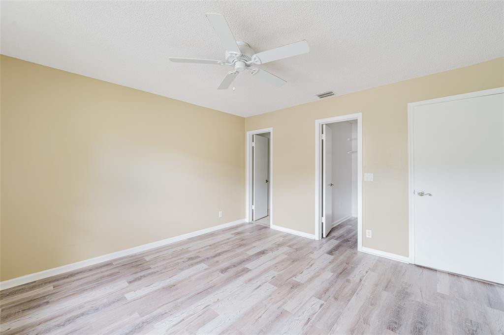 Undisclosed Address Boca Raton, FL 33428 - Photo 23 of 36 a view of an empty room with wooden floor