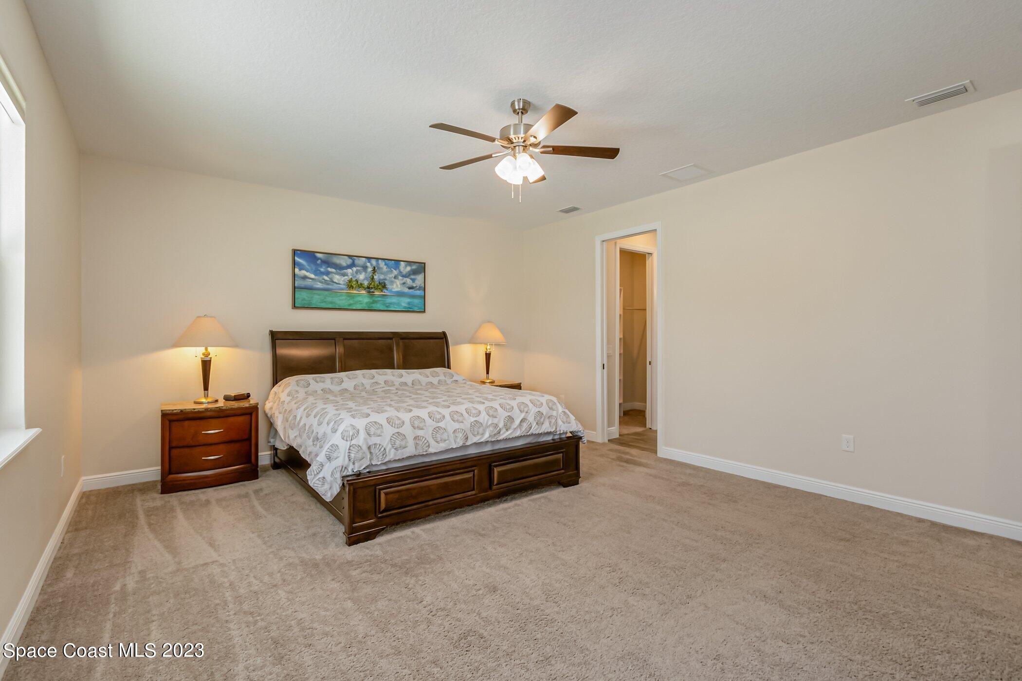 235 Deer Run Road Palm Bay, FL 32909 - Photo 15 of 49 235-Deer-Run primary bedroom towards bat