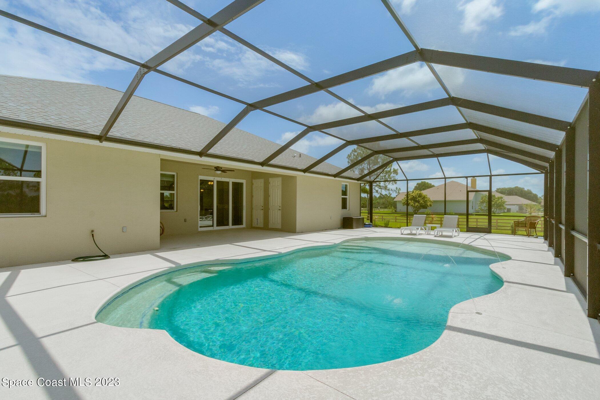 235 Deer Run Road Palm Bay, FL 32909 - Photo 28 of 49 235-Deer-Run-115.jpg-SMALL pool long vie