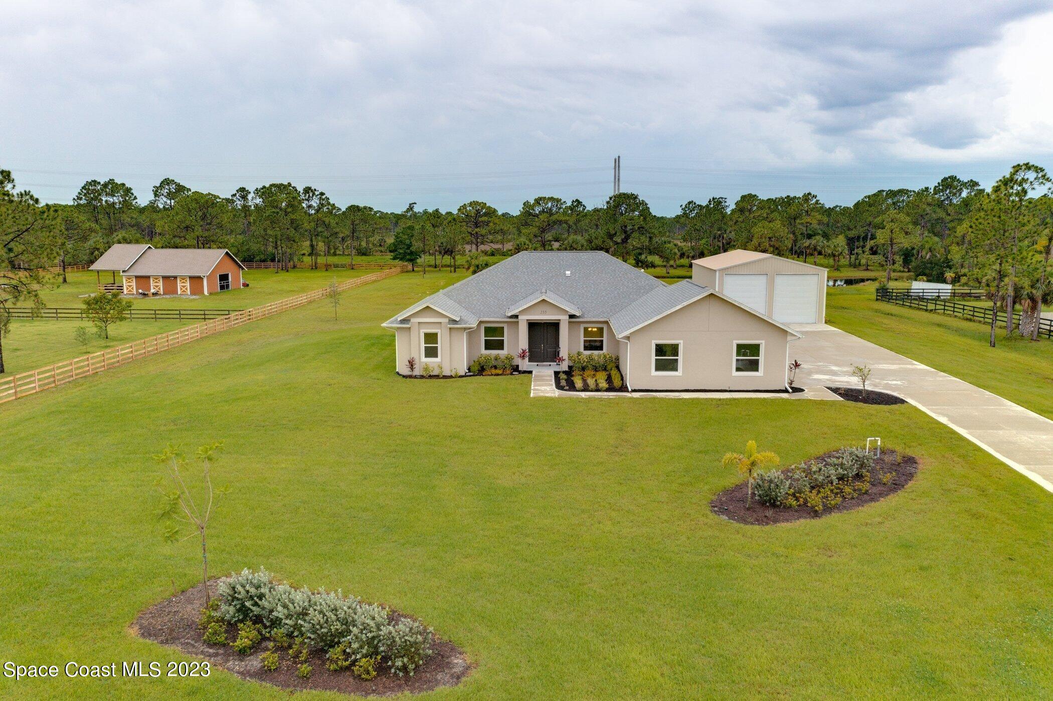 235 Deer Run Road Palm Bay, FL 32909 - Photo 36 of 49 235-deer-run-aerials-front close up