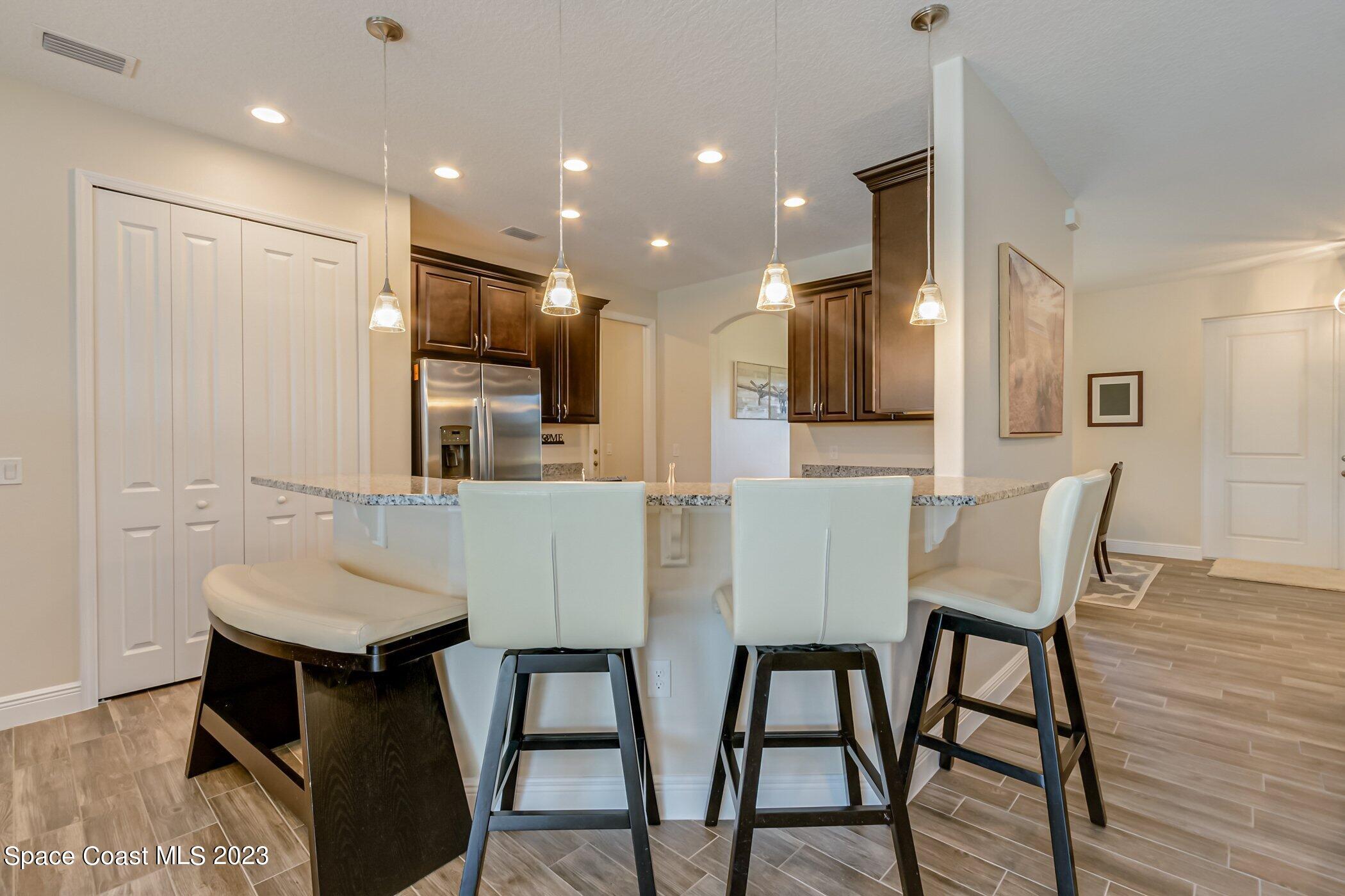 235 Deer Run Road Palm Bay, FL 32909 - Photo 7 of 49 235-Deer-Run-kitchen bartop - Copy