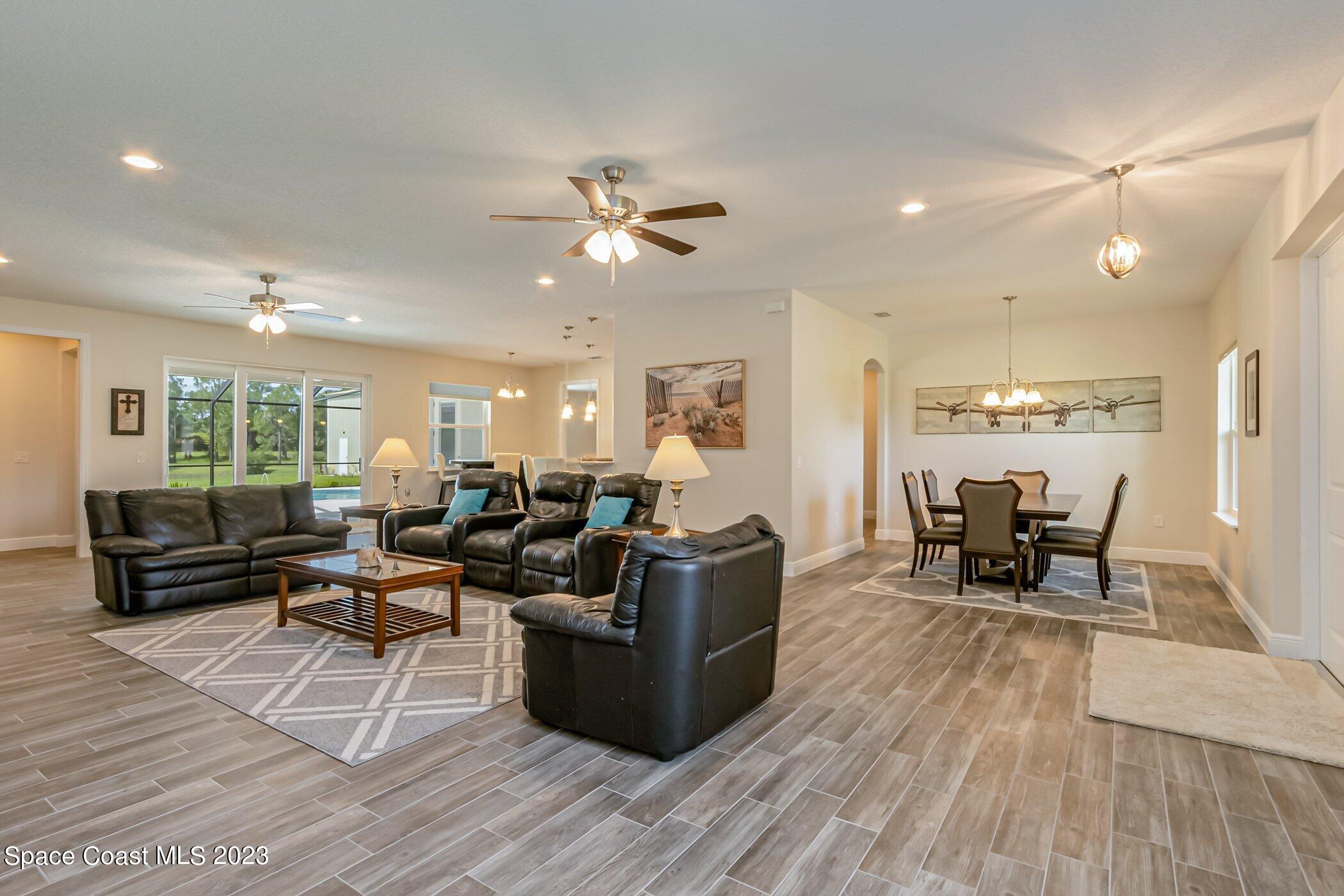 235 Deer Run Road Palm Bay, FL 32909 - Photo 9 of 49 235-Deer-Run-212 living and dining rooms