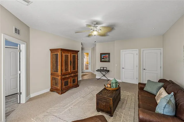 a kitchen with stainless steel appliances granite countertop a refrigerator a sink dishwasher a stove top oven a large refrigerator and cabinets with wooden floor