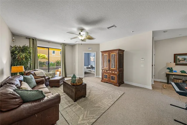 a kitchen with granite countertop sink stove and cabinets
