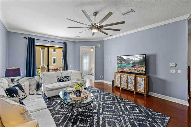 a bedroom with furniture and a wooden floor