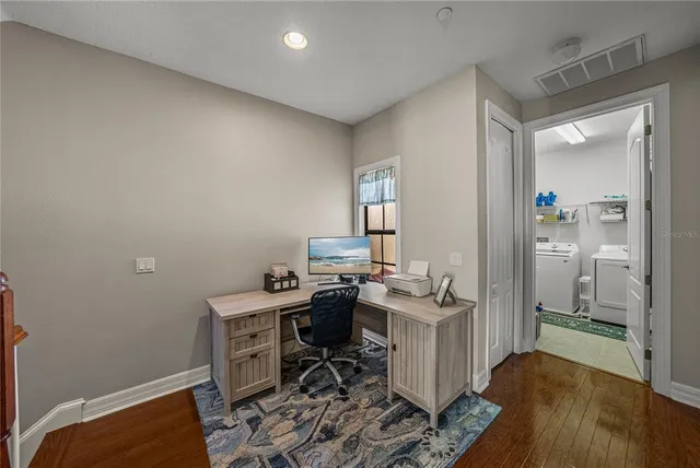 a swimming pool with outdoor seating and yard