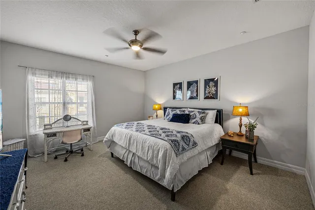a view of a house with swimming pool and porch with furniture