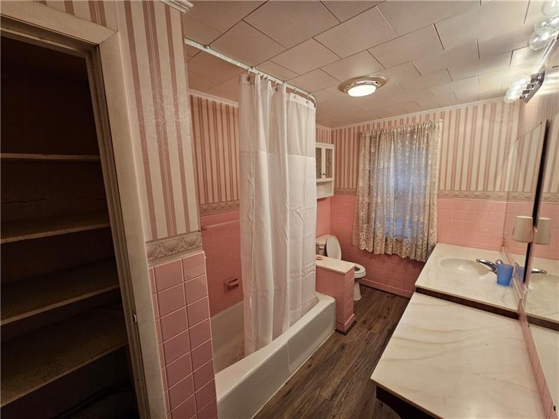 325 Adams Street Rochester, PA 15074 - Photo 12 of 14 a bathroom with a bathtub and a shower