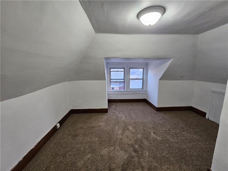 325 Adams Street Rochester, PA 15074 - Photo 13 of 14 an empty room with a chair and a window
