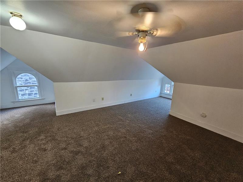 325 Adams Street Rochester, PA 15074 - Photo 14 of 14 a view of an empty room with a chandelier fan