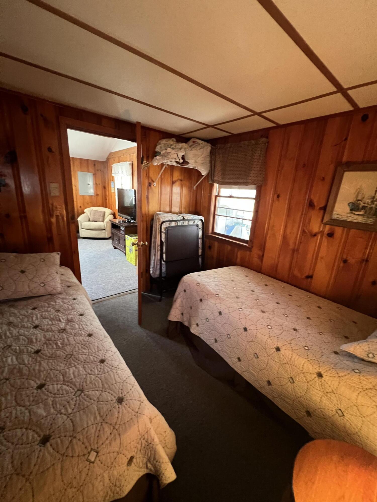 7 A Toms Path Dennis Port, MA 02639 - Photo 11 of 23 a bedroom with a bed and wooden floor