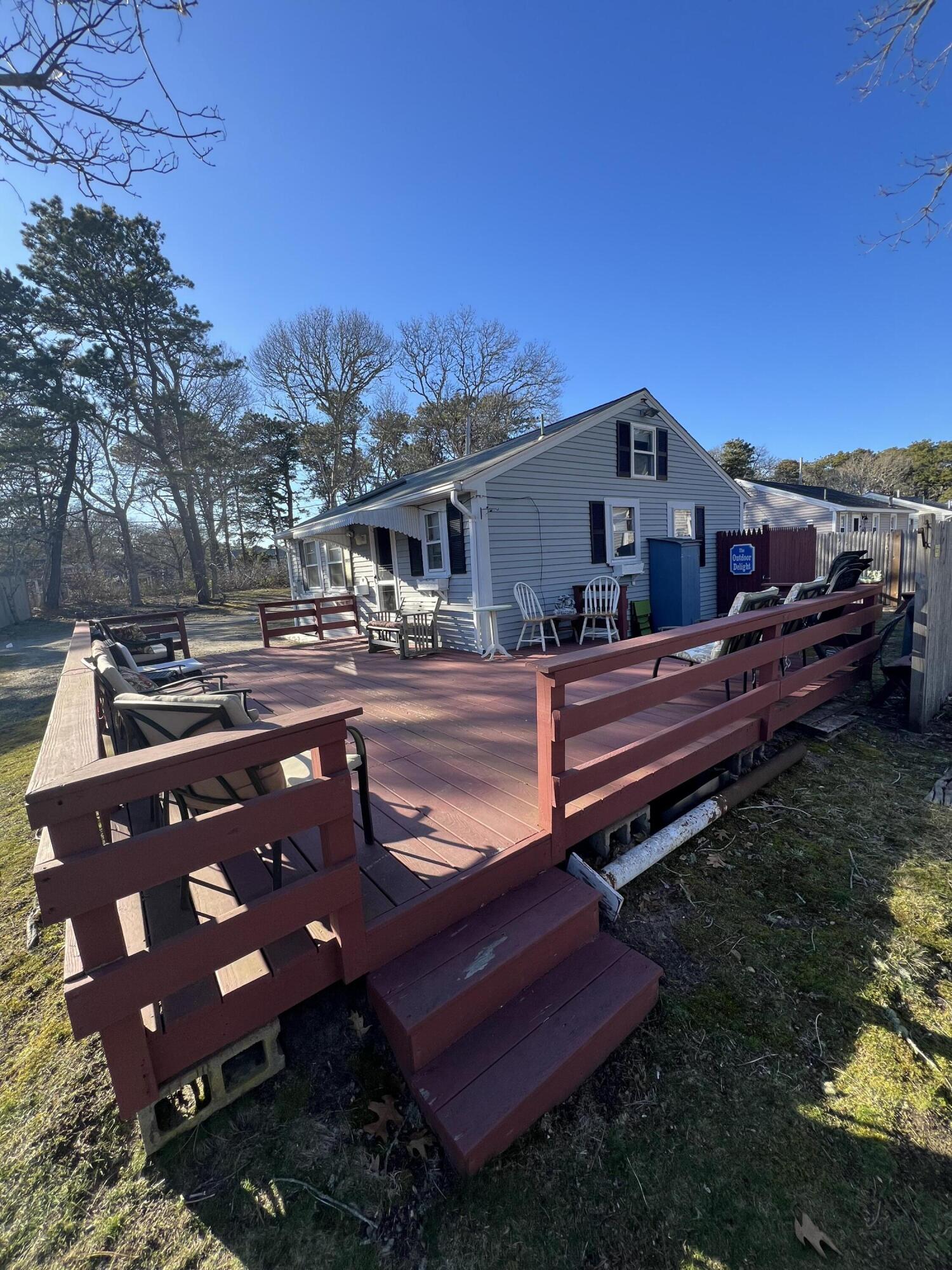7 A Toms Path Dennis Port, MA 02639 - Photo 14 of 23 a view of a backyard with sitting area