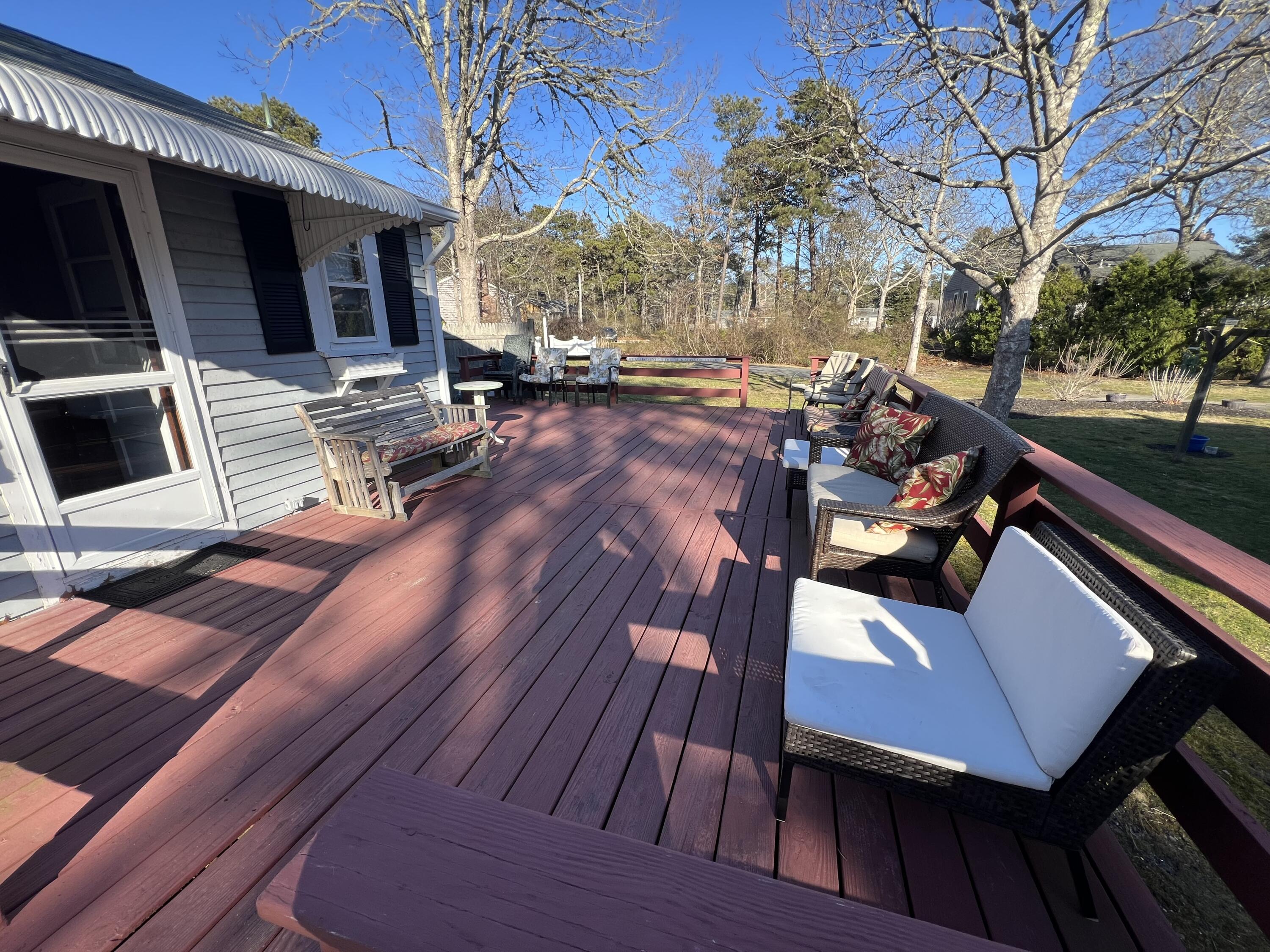 7 A Toms Path Dennis Port, MA 02639 - Photo 16 of 23 a view of a patio with wooden floor