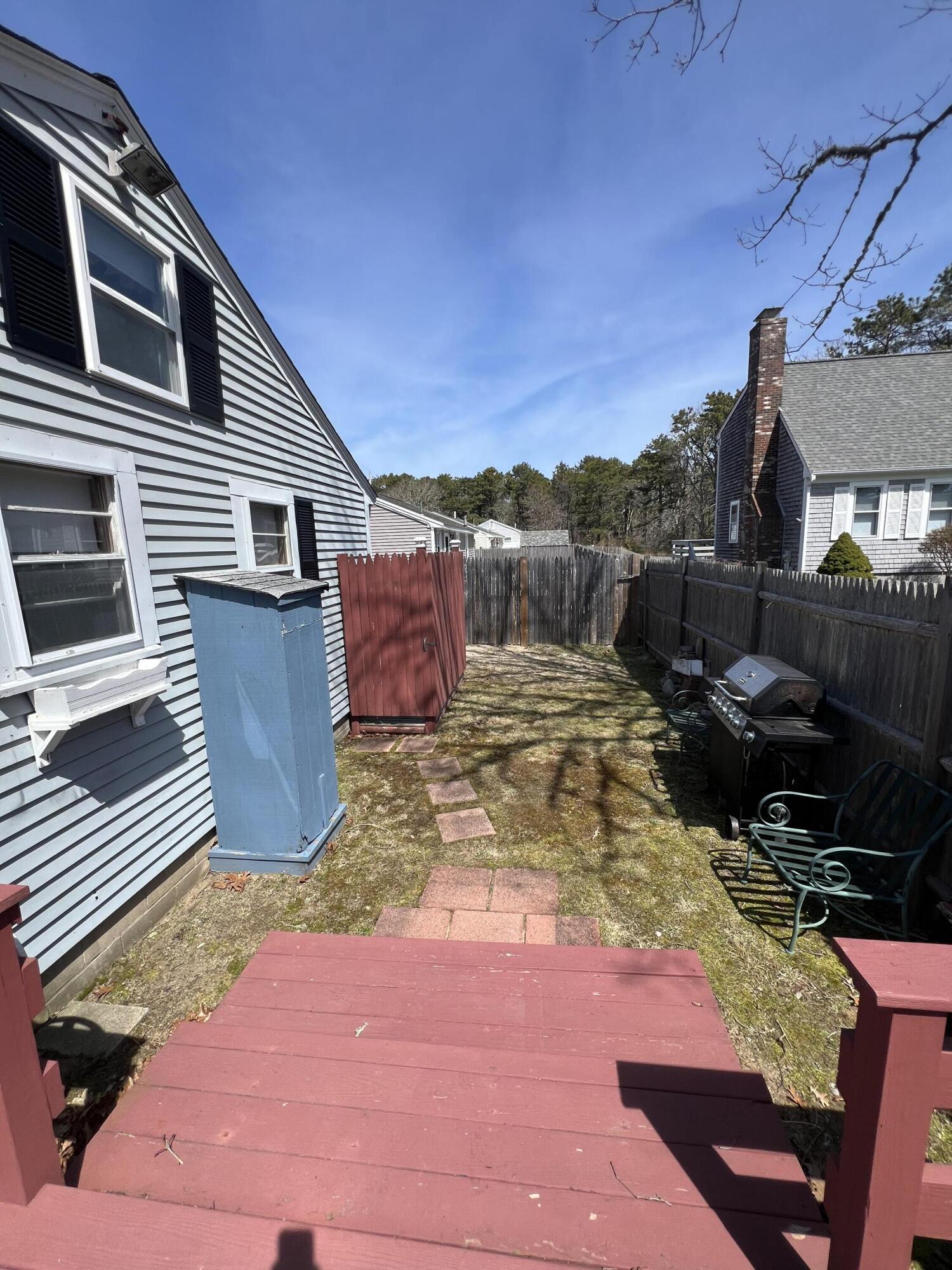 7 A Toms Path Dennis Port, MA 02639 - Photo 18 of 23 a view of a backyard with sitting area