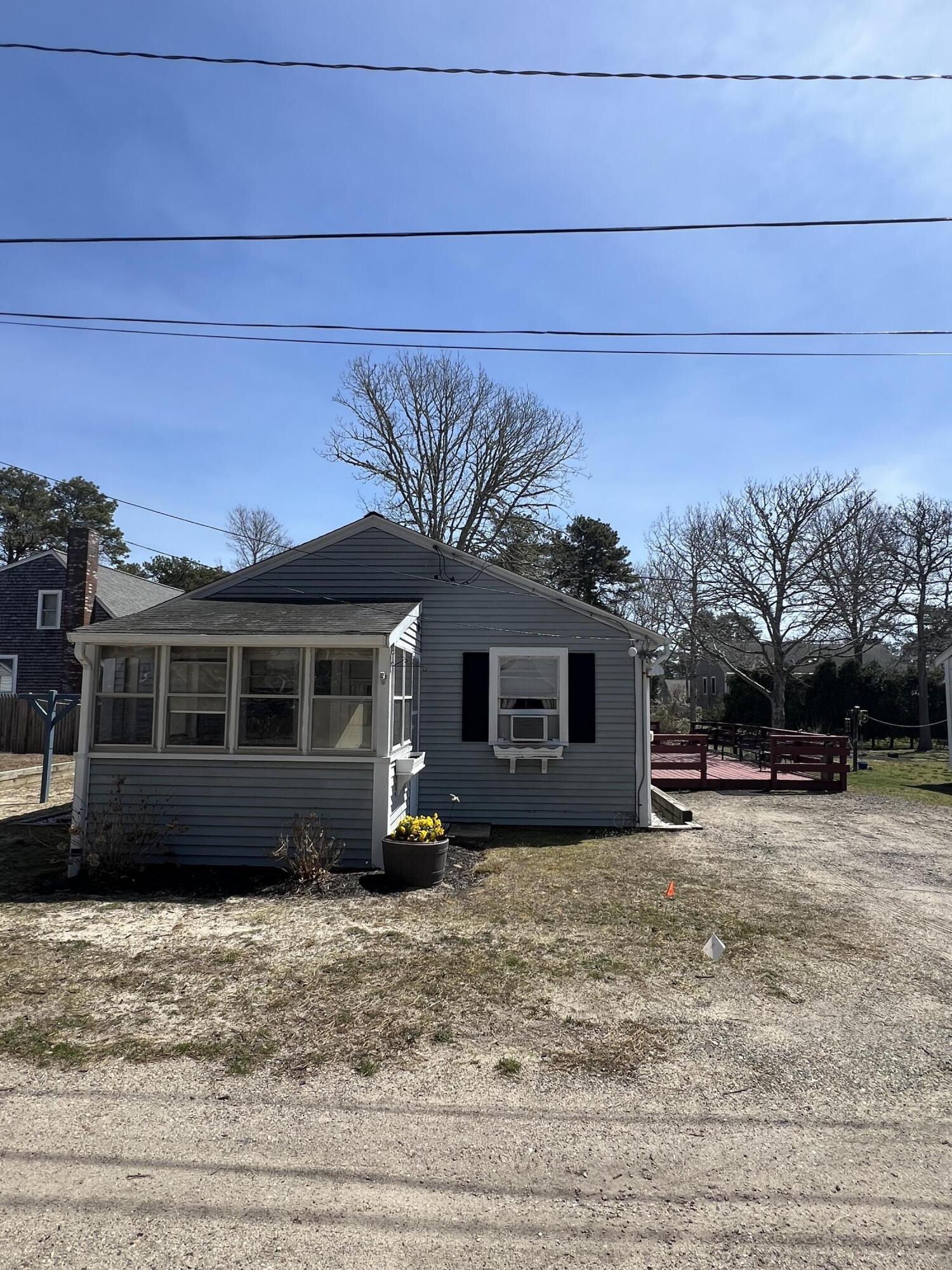 7 A Toms Path Dennis Port, MA 02639 - Photo 22 of 23 a view of a house with a patio