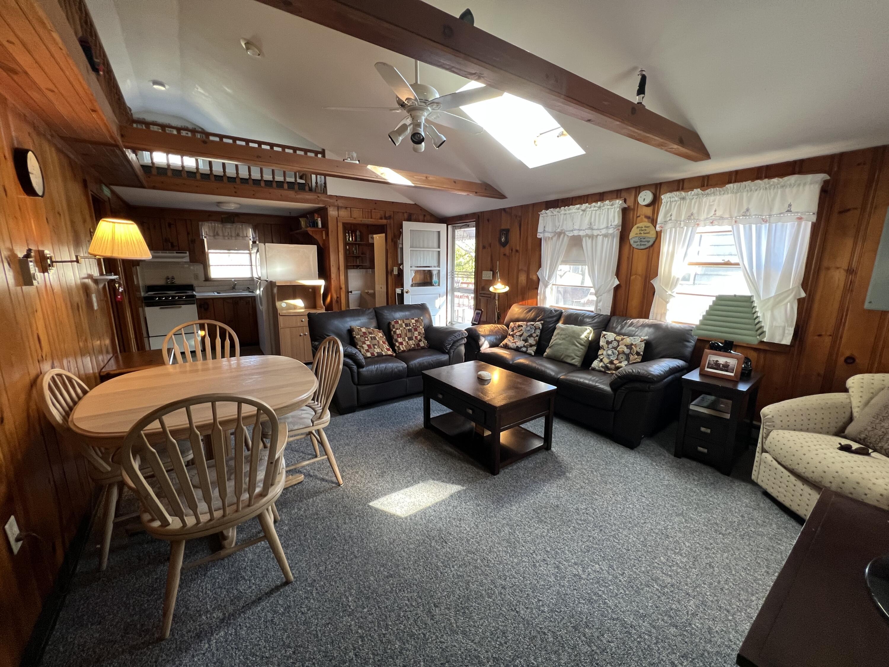 7 A Toms Path Dennis Port, MA 02639 - Photo 5 of 23 a living room with furniture and a large window