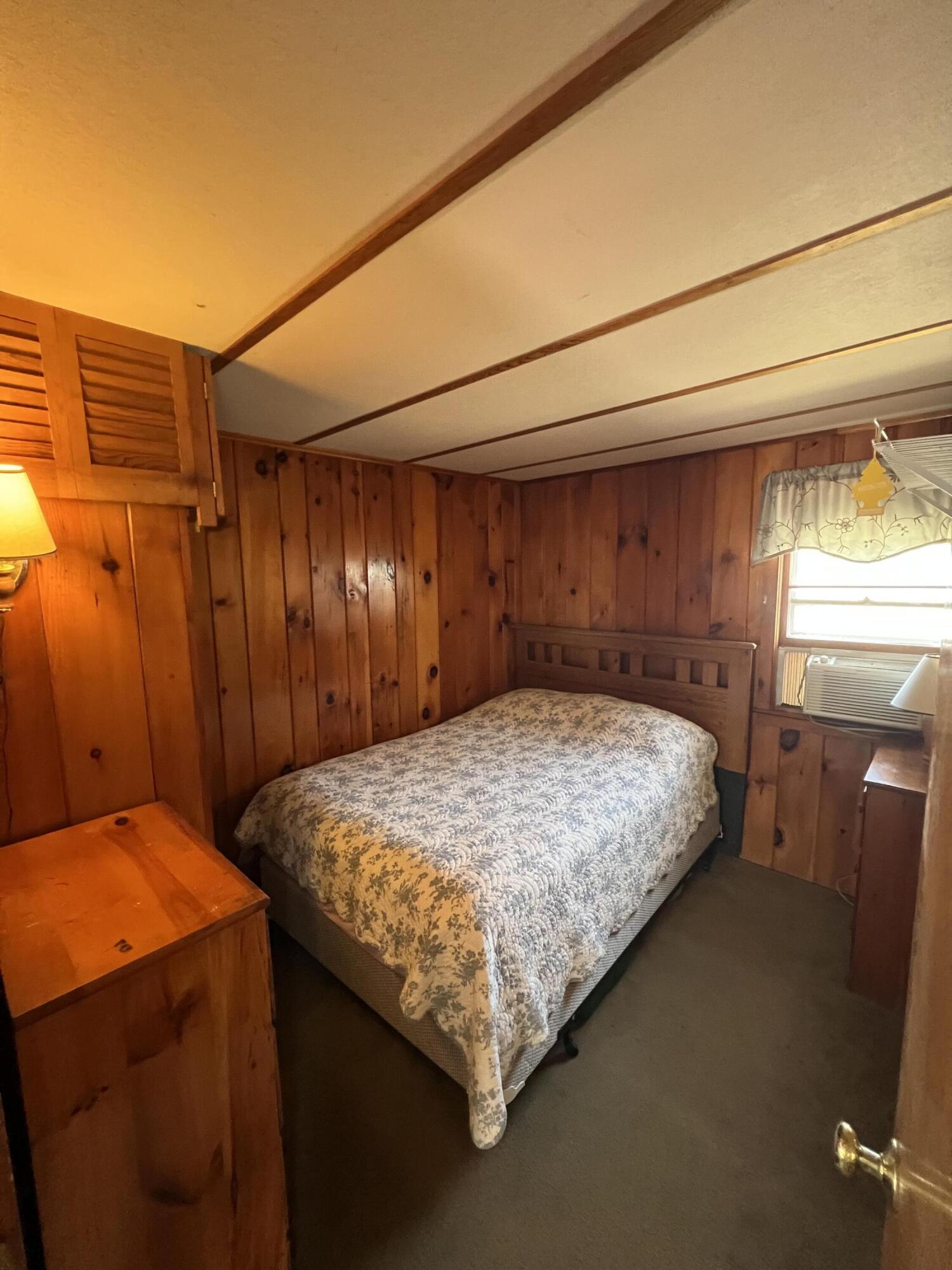 7 A Toms Path Dennis Port, MA 02639 - Photo 9 of 23 a bed sitting in a bedroom next to a window