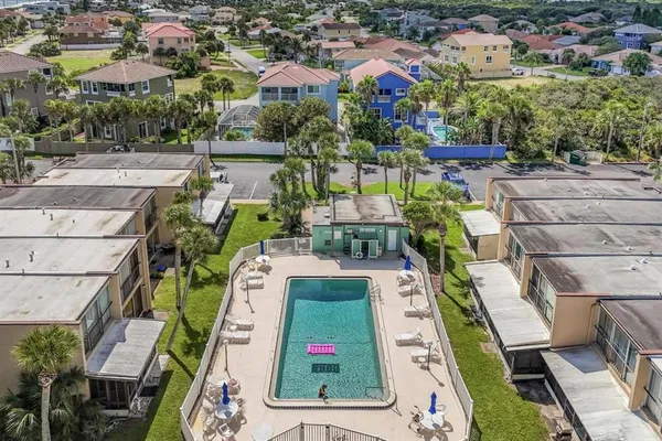 an aerial view of a house with a ocean view