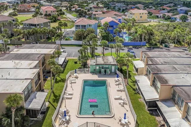 an aerial view of a house with a ocean view