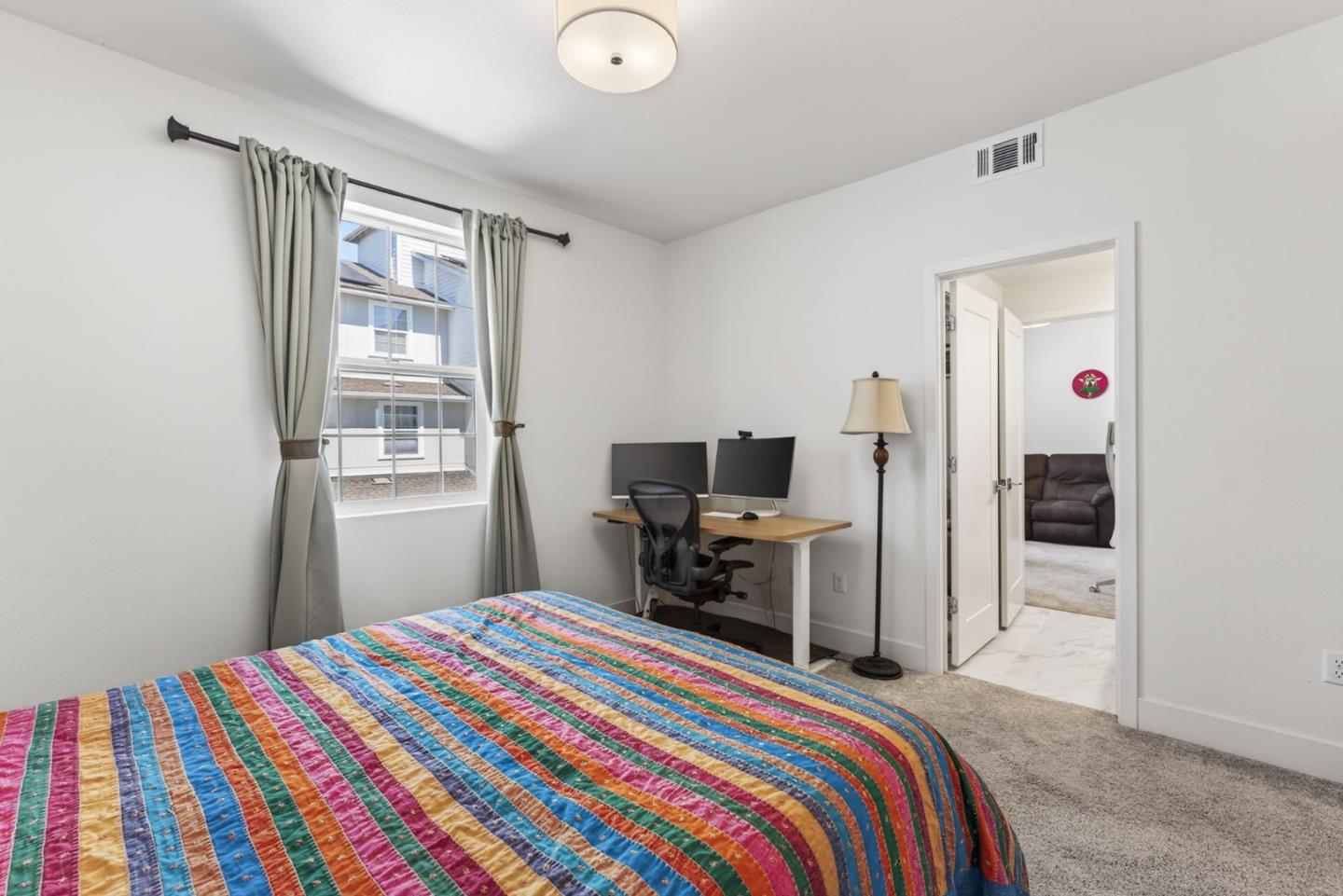 9532 Seawind Way Newark, CA 94560 - Photo 21 of 44 a bedroom with a bed and a tv