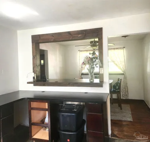 a bathroom with a sink a mirror and a window